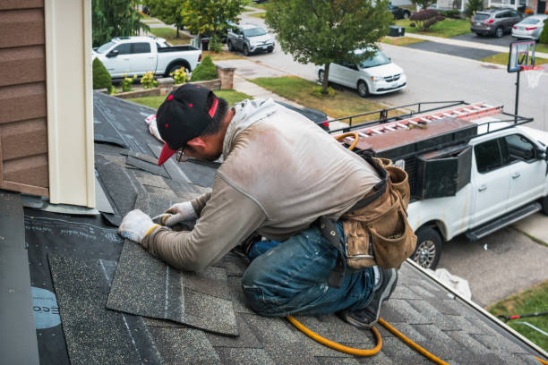 Professional Roofing technician working in Locust Valley, NY